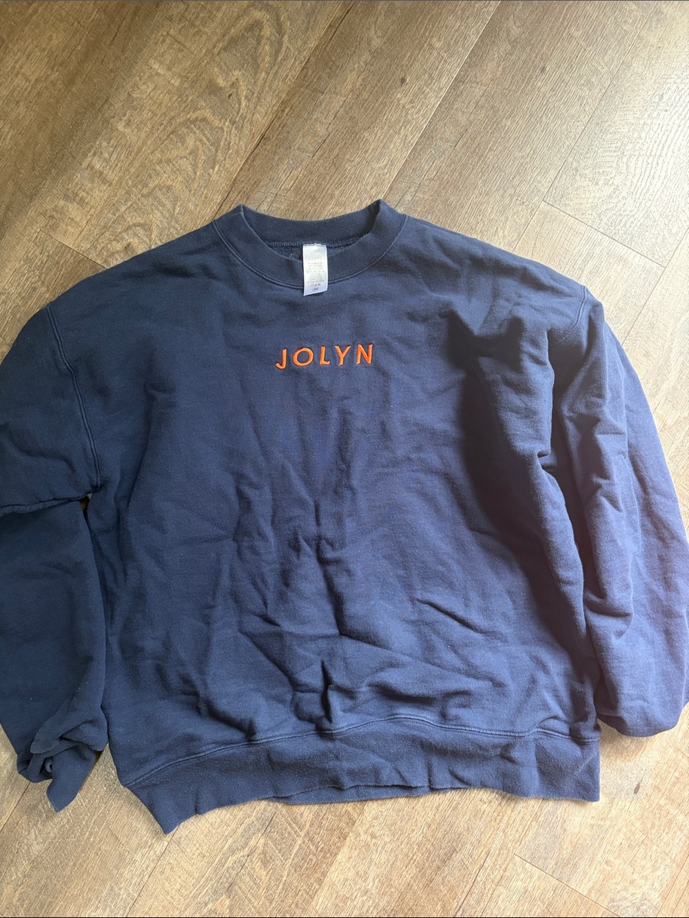 Jolyn Clothing Navy Crewneck Sweatshirt with Orange Logo